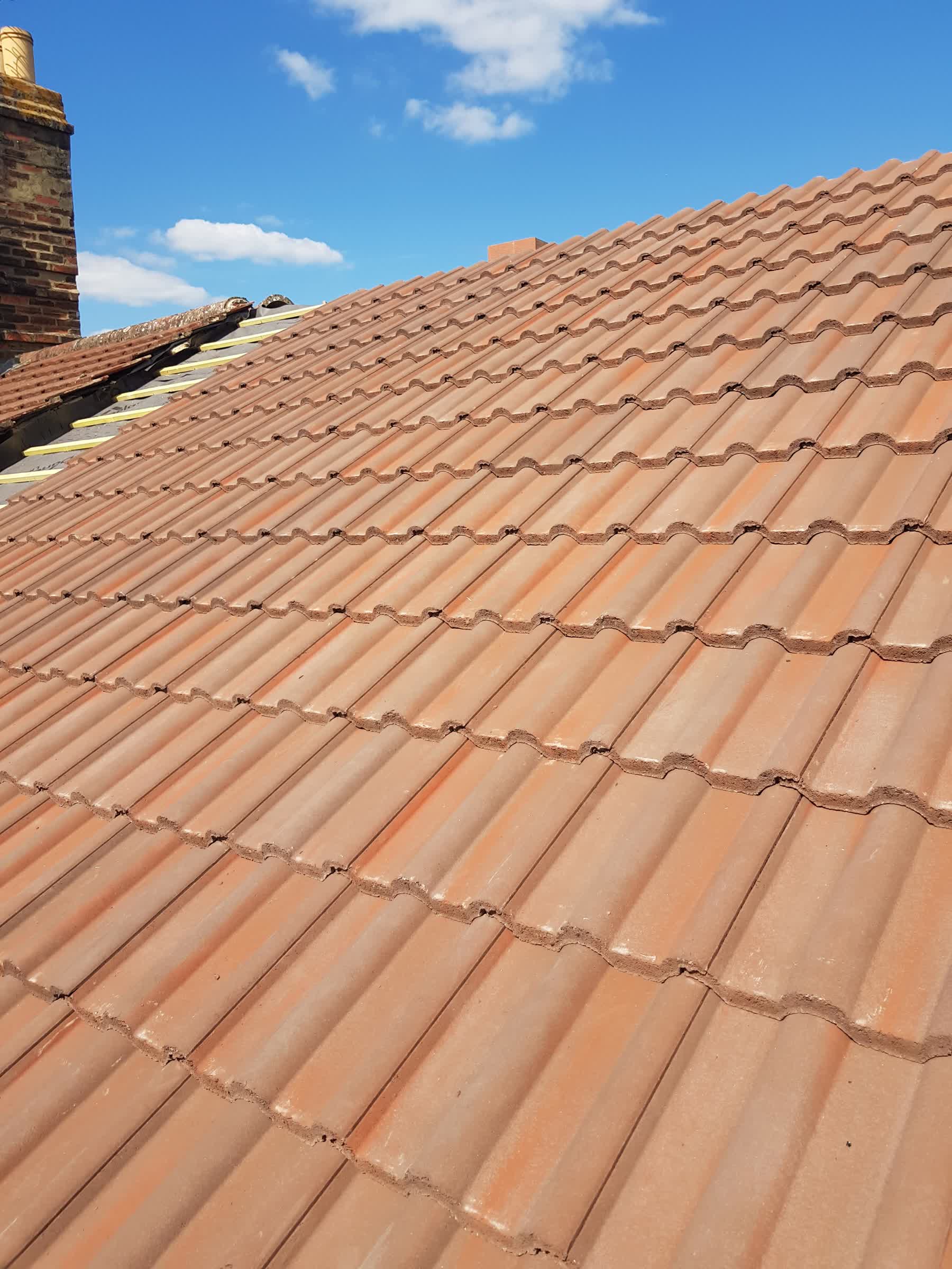 Roof tiles being replaced
