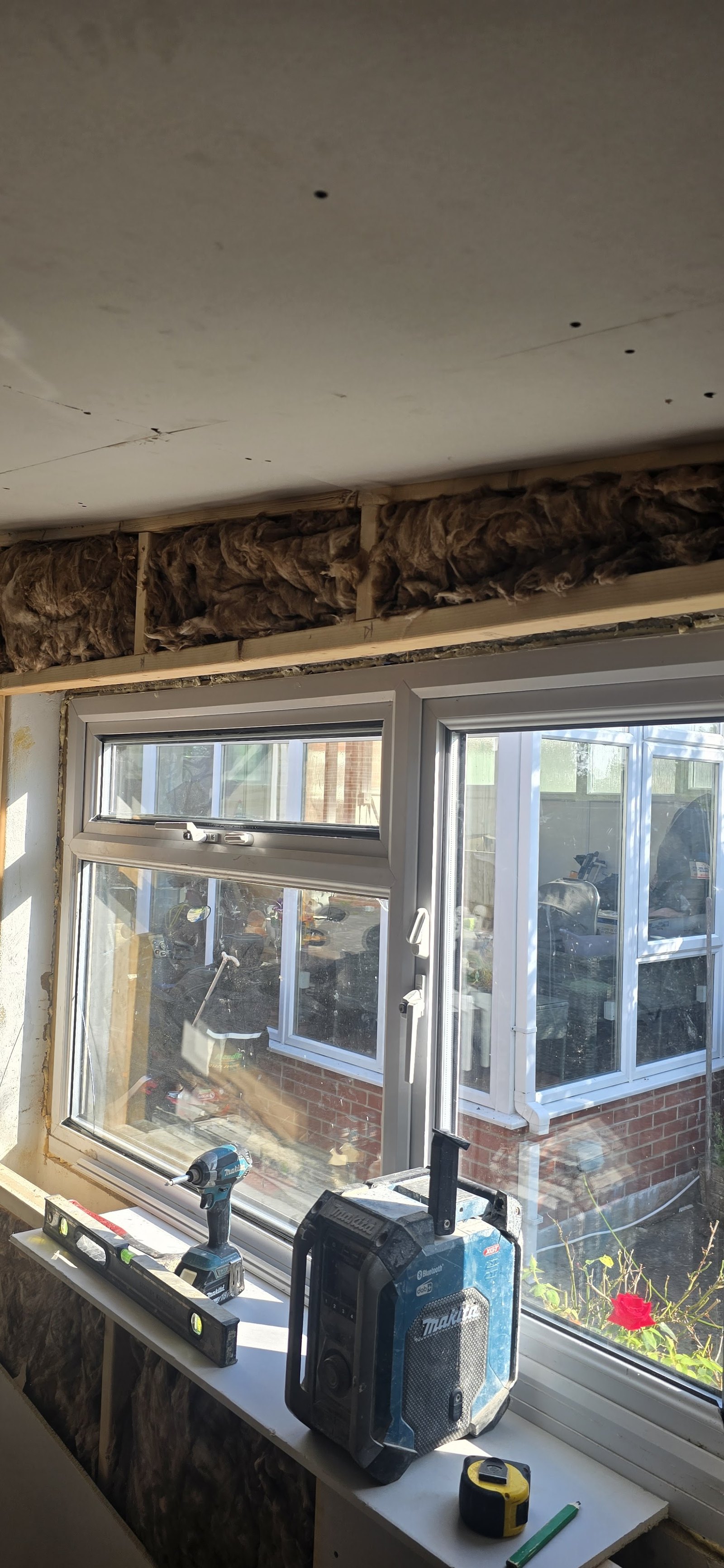 Window work in progress with exposed insulation
